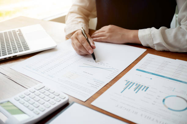 istock Financial inspector calculating a numbers in office room. 1474622046