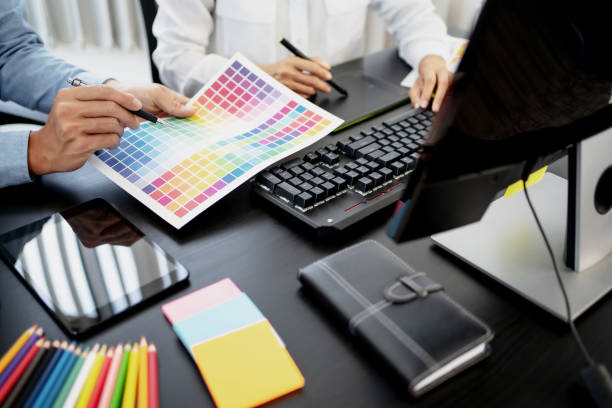 istock Freelance creative designer team creation project with color chart in meeting. 1474624573