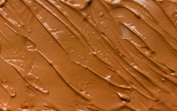 istock Chocolate background. Melted chocolate. Chocolate swirl. 1474624720