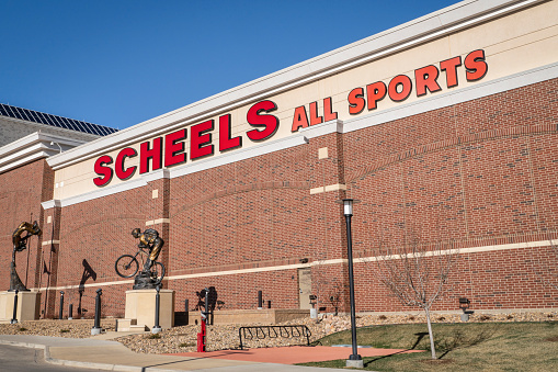 Johnstown, CO, USA - March 18, 2023: Facade sign of Scheels, store chain with apparel, shoes & gear for sports & outdoor recreation, plus merchandise with team logos.