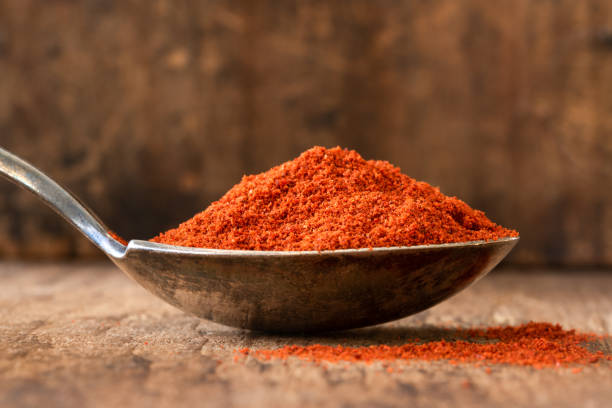 istock Ground Spanish Paprika on a Vintage Spoon 1474626707