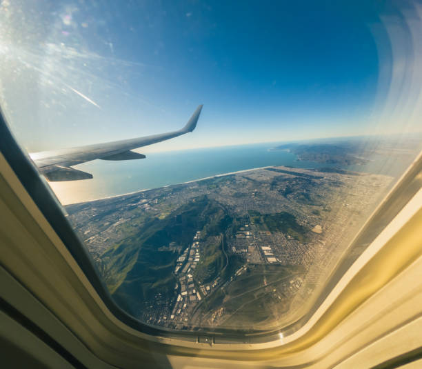 istock View from airplane window. Looking Out the Window of a Plane, Cloudscape. 1474630438