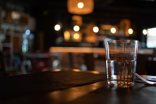 defocused Blurred dark table setting in a restaurant or bar
