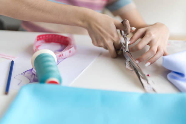istock Cropped image of young beautiful designer working with sketches and tools. 1474632162