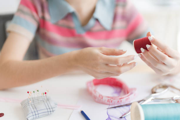 istock Cropped image of young beautiful designer working with sketches and tools. 1474632179