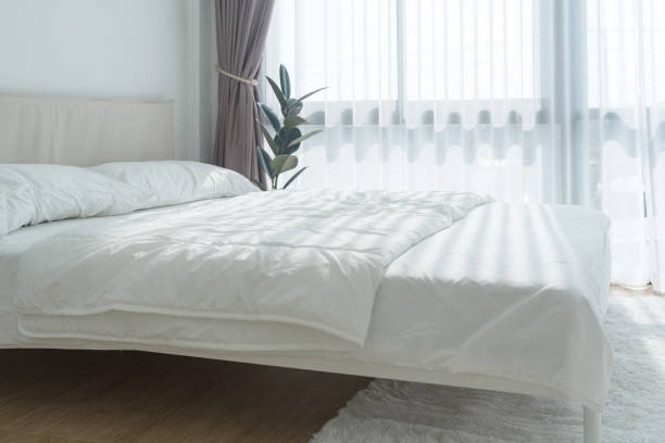istock White bedroom with white curtains and white pillows 1474633553
