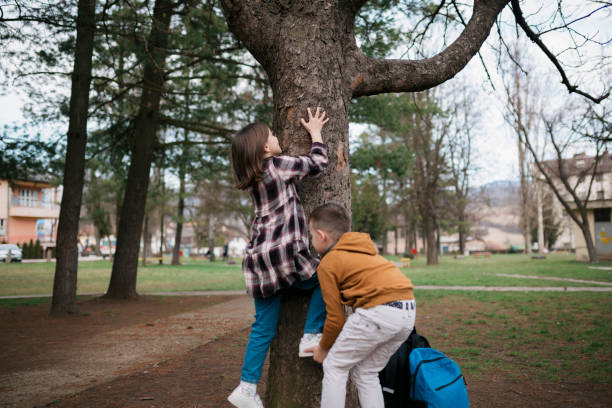 istock Schoolchildren in the park. 1474636594