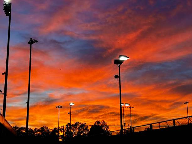 istock Sunset and tennis court lights 1474638566