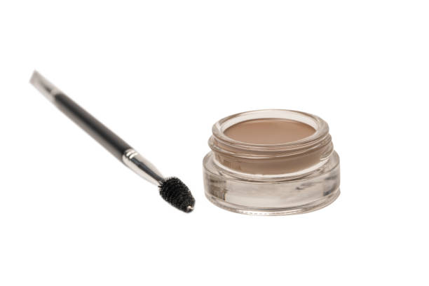 istock A brow pomade in blonde shade with brush isolated on a white background. 1474640220