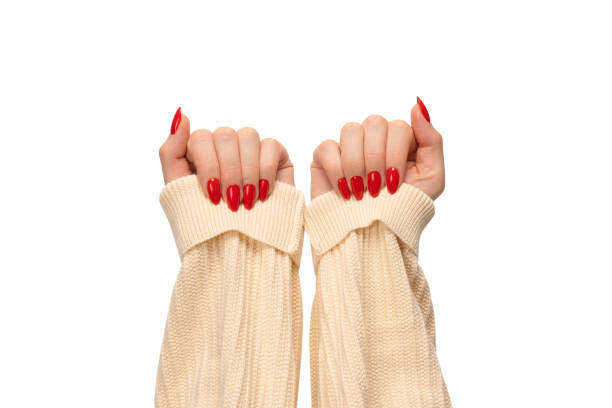 istock Woman hands with red nails isolated on a white background. 1474640251