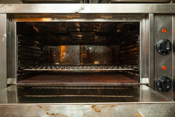 istock Not a new electric oven with two controls and dirty. 1474641296