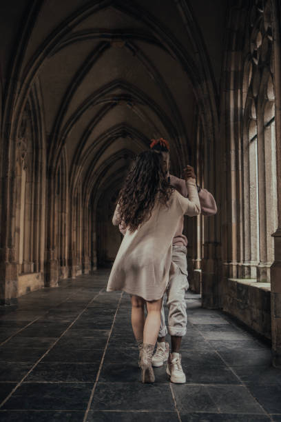 istock Urban mixed race couple dancing in classical public place 1474641608