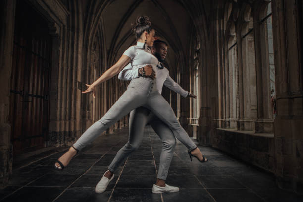 istock Urban mixed race couple dancing in classical public place 1474642507
