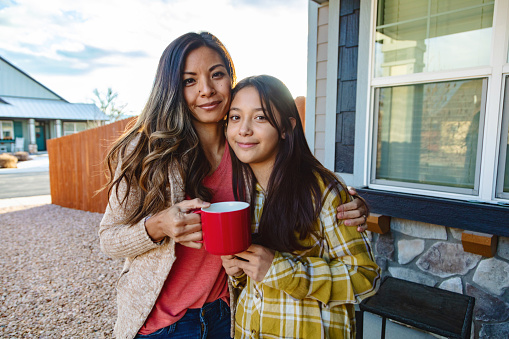 Western USA Small Town America at Sunset in Winter Asian Mother and Multiracial Daughter Outdoors Relaxing and Communicating Without Technology Quality Time Photo Series - Matching Video Available in Portfolio