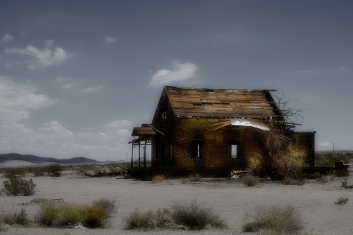As the large freeways took the place of Route 66 for east-west driving trips, businesses and homes along the route dried up and were abandoned. This is such a building. Manipulated to increase the eerie look of abandonment.