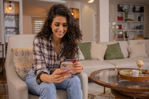 istock Happy young customer enjoys shopping online 1474646849