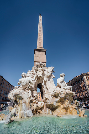 Fountain of the Four Rivers with an Egyptian obelisk on the famous Piazza Navona Square, Rome, Italy.