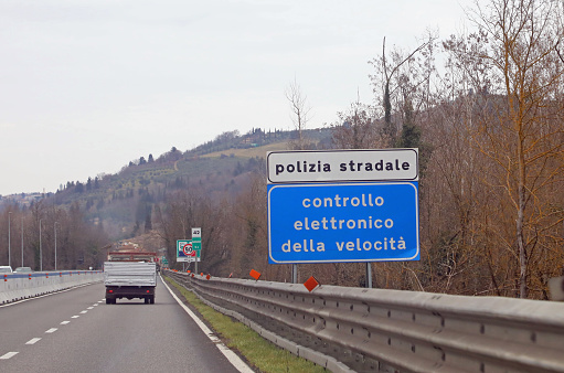 Siena, SI, Italy - February 21, 2023: Italy Warning Panel that means Police Speed Check in the highway