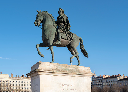 LYON, FRANCE- MARCH 15, 2023 : View of famous Louis XIV sttue on Bellecour place in Lyon city, France