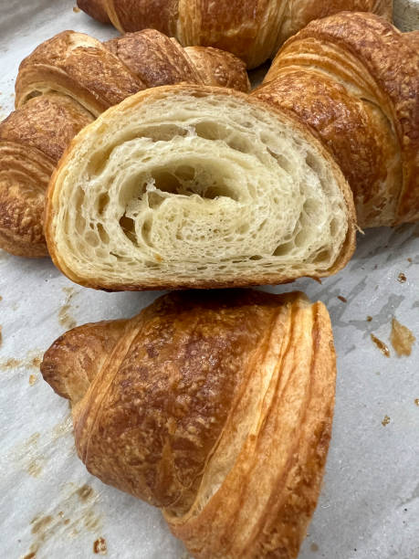 istock Fresh croissant on  wax paper. Top view, background, Rustic. Bakery concept 1474654424