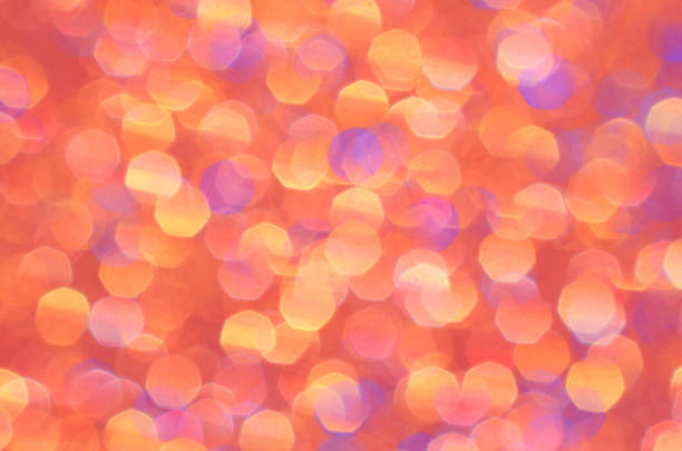 Orange, yellow, gold and purple abstract background. Bright sparkle and glow of brilliant color for festive backdrop. Beautiful pastel pattern, cheerful glowing colors. stock photo