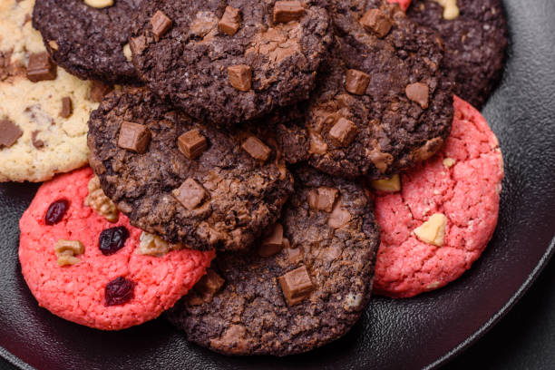 istock Delicious fresh crispy oatmeal cookies with chocolate and nuts 1474664810