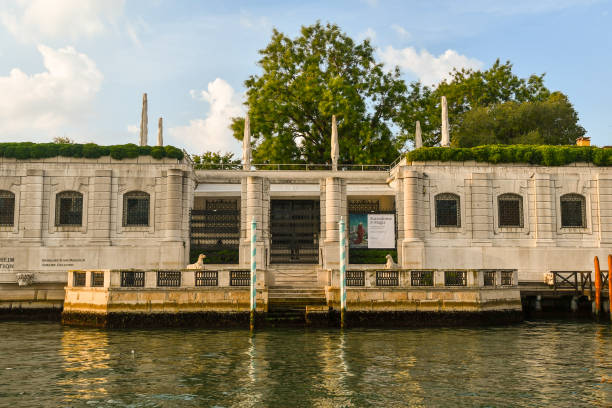 Exterior of the Peggy Guggenheim Collection, an art museum on the Grand Canal in the Dorsoduro sestiere, Venice, Veneto, Italy Venice, Veneto, Italy - 08 26 2022: The Peggy Guggenheim Collection is one of the most visited attractions in Venice. peggy guggenheim stock pictures, royalty-free photos & images