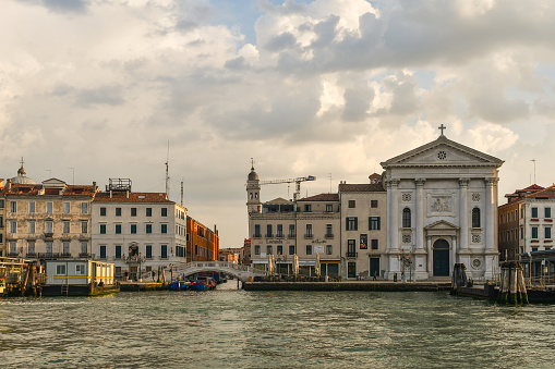 Venice, Veneto, Italy - 08 26 2022: The bell tower of the church of San Giorgio dei Greci is among the four most inclined towers in Venice.