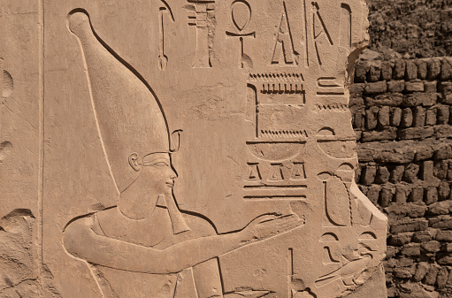 wall relief showing the Pharaoh Thermoses III at  Karnak Temple . Luxor. Egypt .