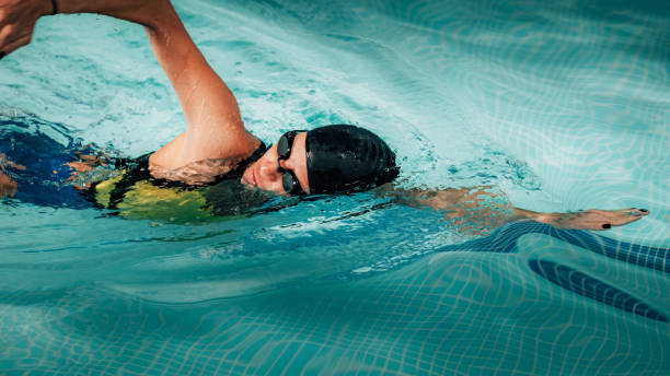 Recreational Front Crawl Swimming in The Pool. stock photo