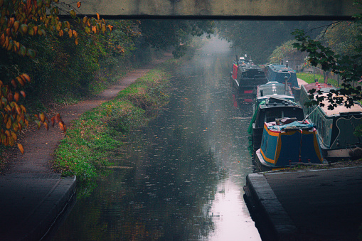 A picture taken around the canals in Wolverhampton, in a foggy morning. Some boats just sitting still.