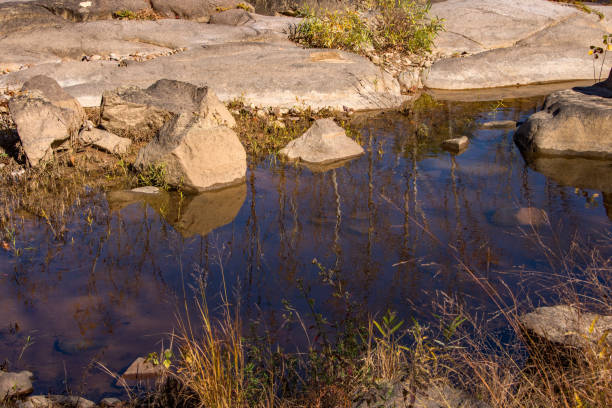 istock Silver Mines RA - Reflections Beside Weathered Rock 1474689361