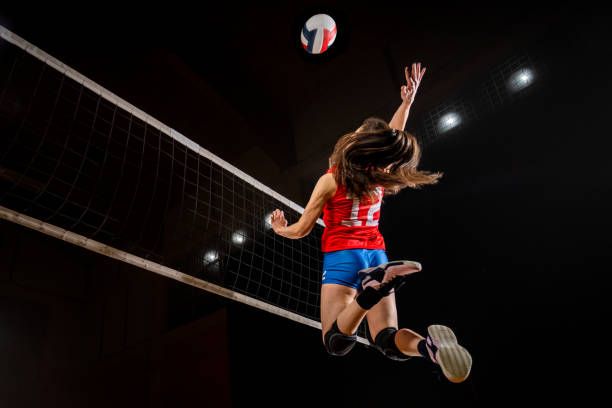 istock Female volleyball player jumping high 1474695914