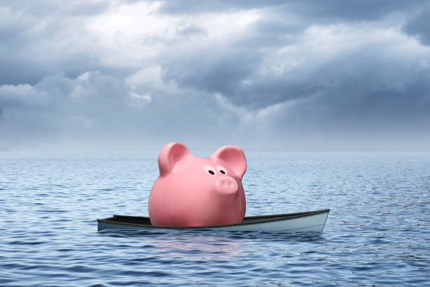 istock Piggy Bank In Sinking Boat 1474696151