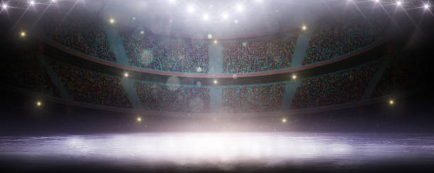 istock Sport background. Empty ice rink illuminated by spotlights. Violet ice floor texture and mist. Snow and ice background. Scene Illumination 1474697475
