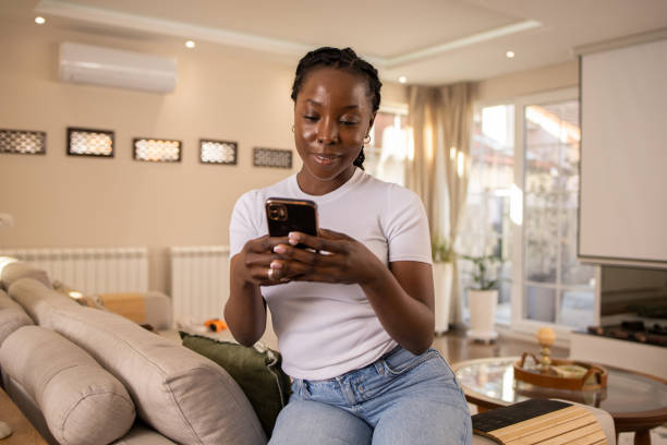 istock Happy young woman using phone 1474698130