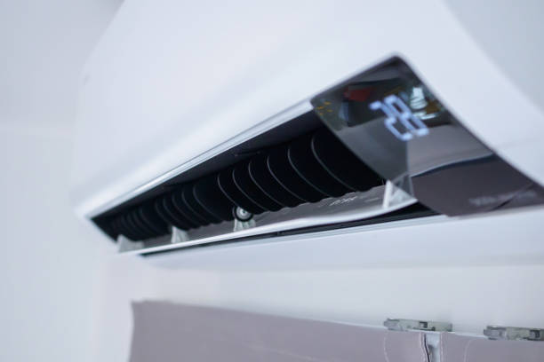 istock Air conditioner on white wall room interior background 1474707373