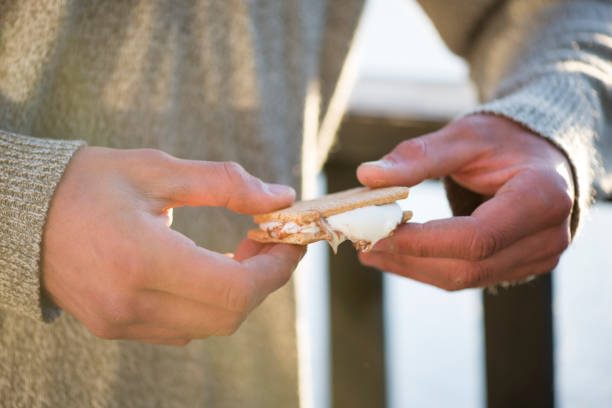 istock Holding a S'more Dessert in the Summer 1474709636