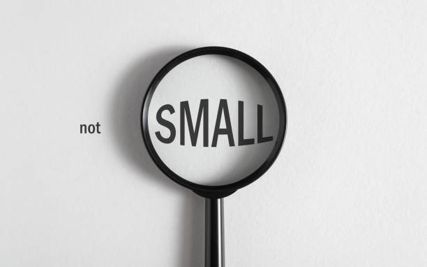 istock Magnified word Small magnifying glass, top view. Creative concept of perception, sight 1474722425