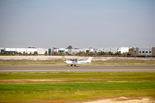 Private Cessna 172S aircraft with registration N92266 taxiing at Long Beach Airport in Feb 2022.