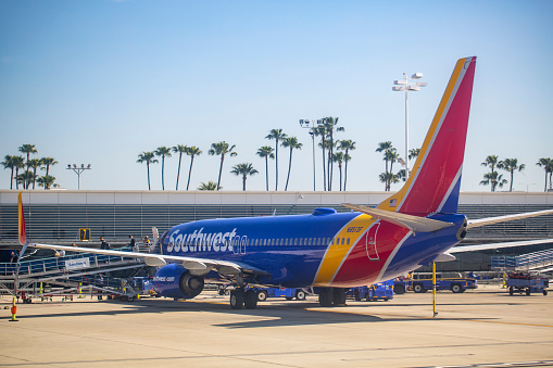 Southwest Airlines Boeing 737-8H4 aircraft with registration N8513F parked at gate at Long Beach Airport in Feb 2022.