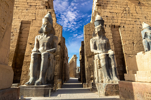 Giza, Egypt - March 15, 2010. Panoramic shot of tourists at The Sphinx and Great Pyramids in Giza, Egypt. Multiple files stitched.