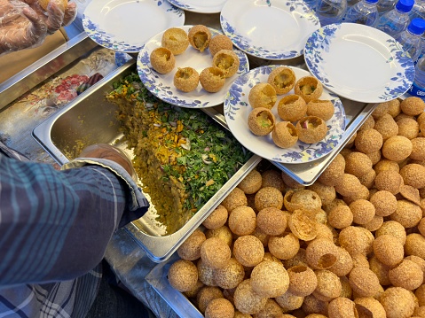 Pani Puri is a combination of street food recipe made with small puri balls filled with spiced and mashed aloo and a specially made spiced water.