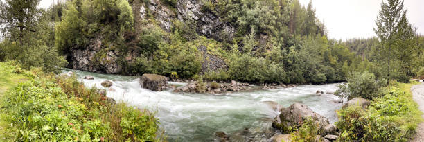 Panorama image of the little Susitna river in Hatcher pass Alaska a panoramic view of the Susitna river in august. talkeetna mountains stock pictures, royalty-free photos & images