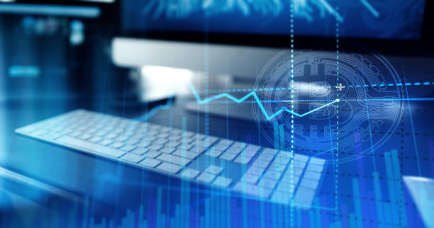 istock Golden bitcoins. Cryptocurrency on computer desk and Double Exposure chart 1474736325