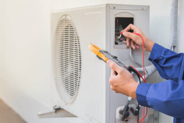 istock Air conditioning, HVAC service technician using gauges to check refrigerant and add refrigerant. 1474740039