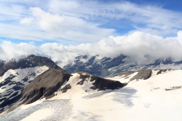 istock Mountain snow and glacier panorama with clouds in Glockner Group, Austria 1474743501