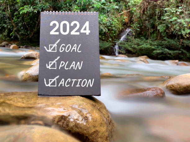 New Year Resolutions Concept 2024 goal plan action written on black board with nature background. New year resolution concept. Inspirational quote. new year resolution stock pictures, royalty-free photos & images
