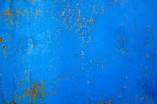 old blue metal sheet with rust background