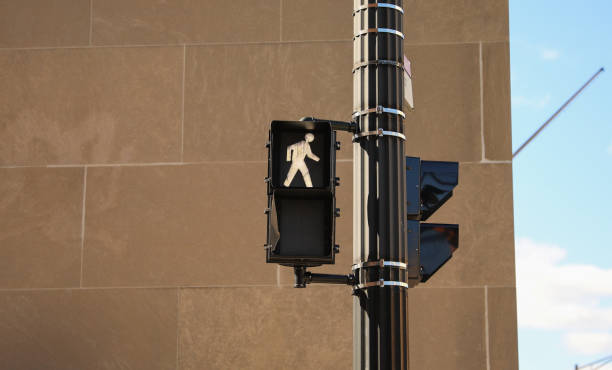 istock street traffic light during rush hour at crosswalk red and yellow at intersection for pedestrian safety depicting a control  warning and caution in urban street with signaling danger 1474749144
